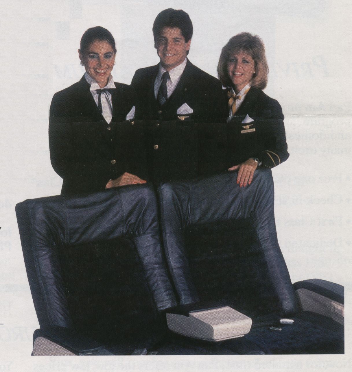 1988 Three Pan Am flight attendants pose by a set of First Class 
